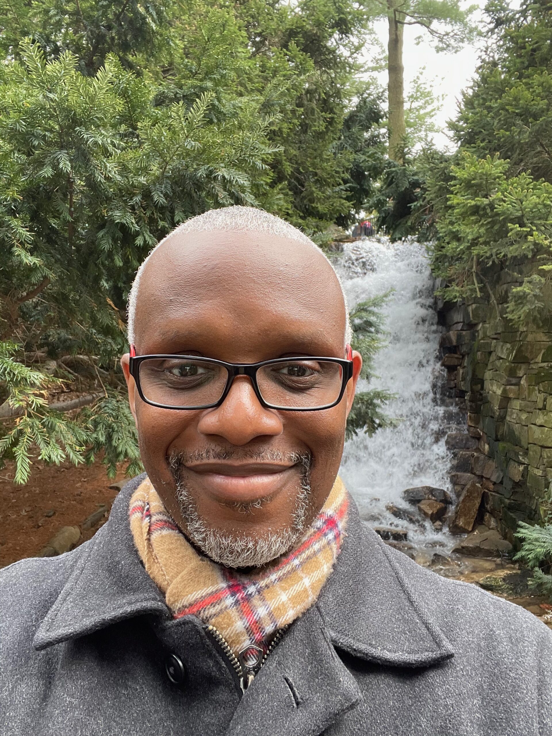 Benjamin Daniel in front of waterfall